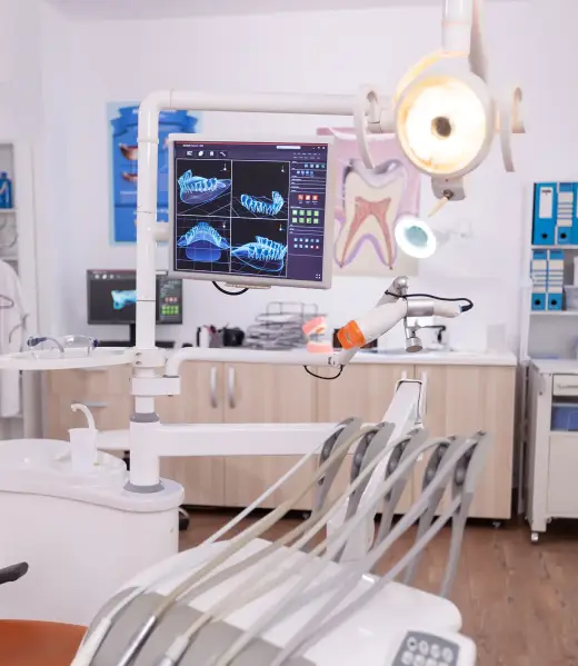 Stomatology dental medical chair with nobody in it equipped with dentistry tools Stomatology dental medical chair with nobody in it equipped with dentistry tools prepared for orthodontic teeth surgery. Professional orthodontist display with tooth radiography images